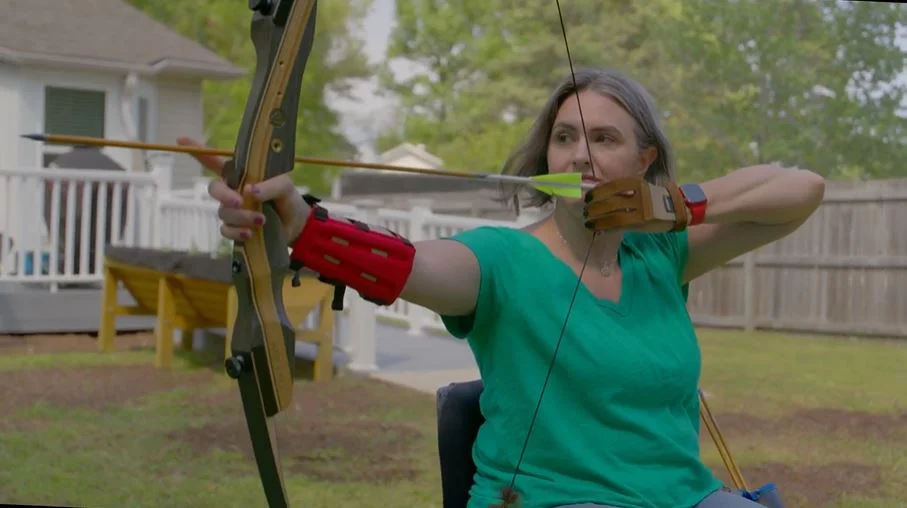 a person holding a bow and arrow